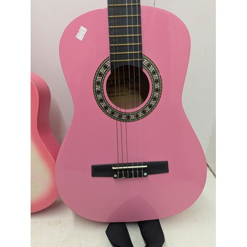 1860 - A Pair of Half Sized Pink Acoustic Guitars