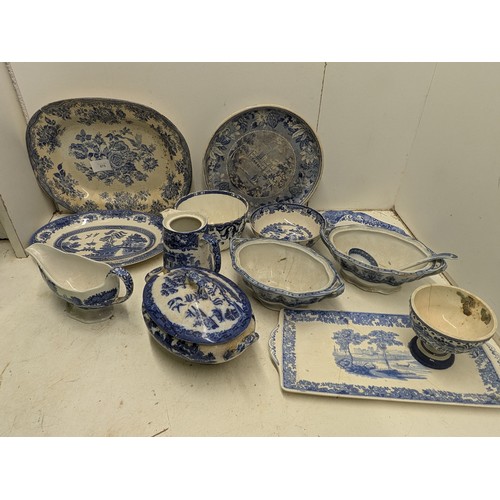 875 - A selection of blue pottery including Doulton's Willow, Alfred meakin, etc