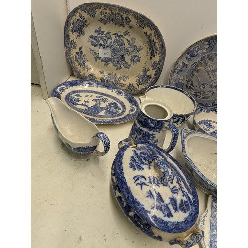 875 - A selection of blue pottery including Doulton's Willow, Alfred meakin, etc