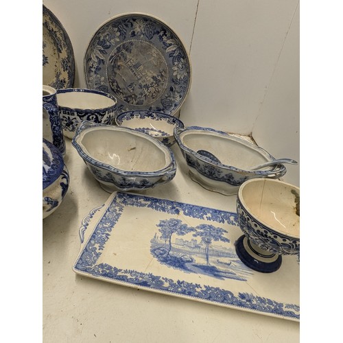 875 - A selection of blue pottery including Doulton's Willow, Alfred meakin, etc