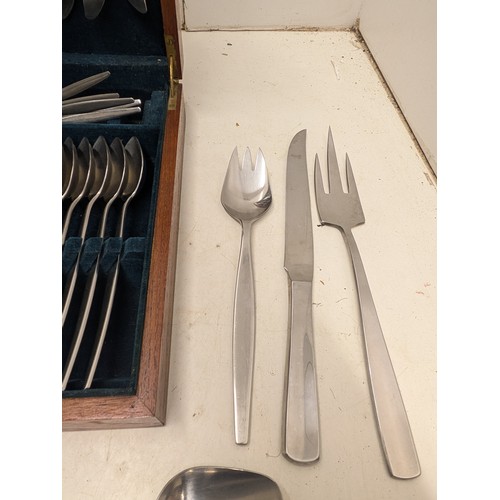 817 - A Gense Stainless steel cutlery set a mahogany display box