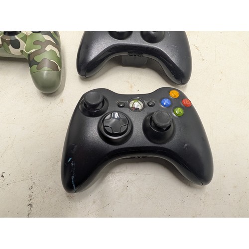 1217 - A Selection of Gaming Controllers Including a Playstation 4 Official Camo Controller