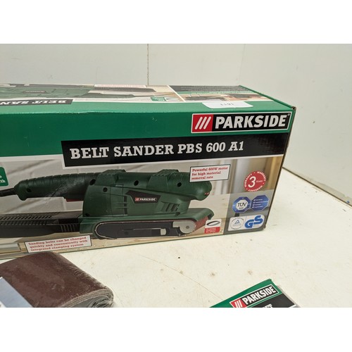 1611 - An Unused Parkside Model PBS 600 A1 Belt Sander With A Selection of Sanding Belts