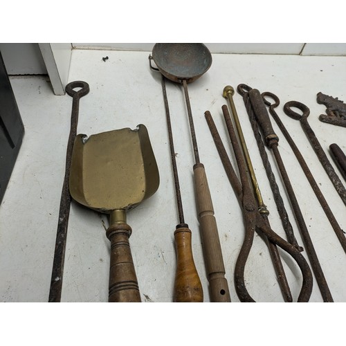 838 - A Large Quantity of Brass and Wrought Iron Fireplace Tools