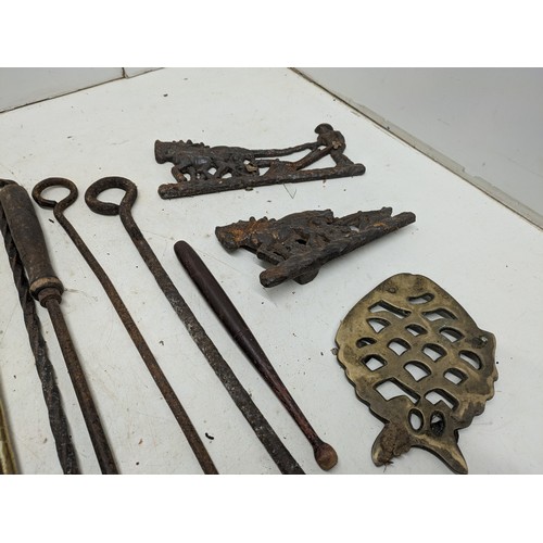 838 - A Large Quantity of Brass and Wrought Iron Fireplace Tools