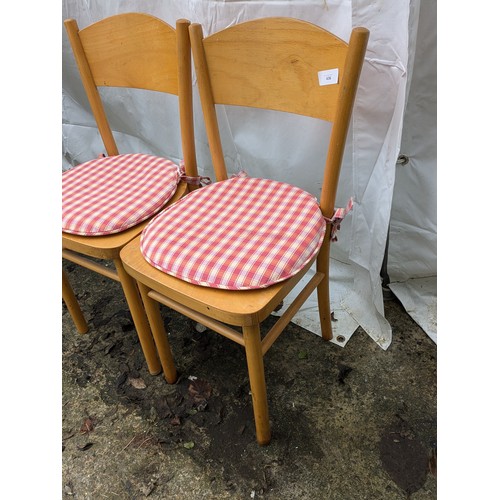 436 - A pair of retro style dining chairs with cushions