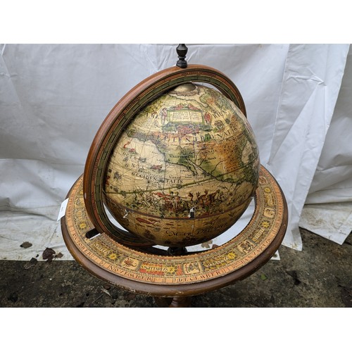 893 - An Antique Style Globe on an Oak Stand