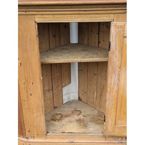 415 - A Rustic Pine Corner Cabinet With 2 Shelves and Brass Accents