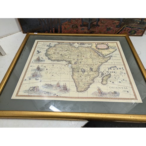 900 - A Pair of Puctures - an oil on canvas depicting a Household Scene, and a vintage map of Africa