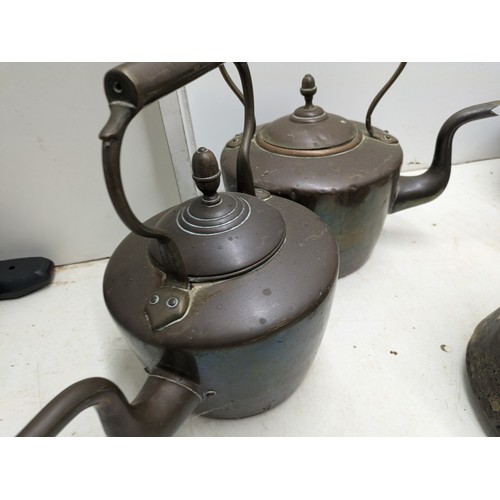 813 - A large selection of vintage copper and brass kitchen equipment including kettles and saucepans