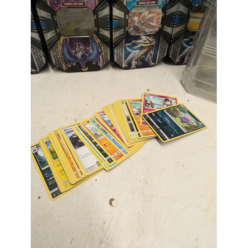 1960 - A large collection Pokémon tins and cards - 7 of the tins contain large quantities of Pokémon cards!... 