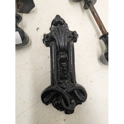 910 - A Pair of Black Wrought Iron Door Knobs and Knocker