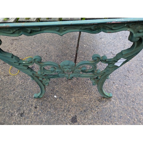 11 - An Outdoor Garden table with wood top and cast iron legs