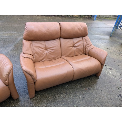 607 - A himola 2 piece brown leather sofa and electric rise and recliner armchair