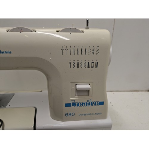 1515 - A creative model 680 sewing machine with pedal and accessories