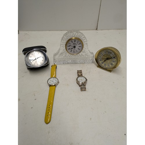 2189 - an assortment of quartz clocks and 2 wristwatches