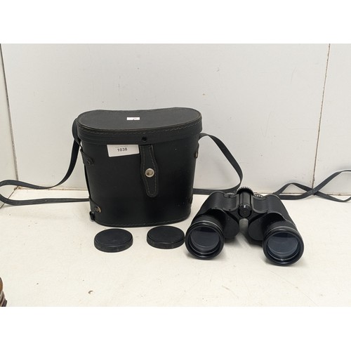 1038 - A Pathescope coated optics 16x50 binoculars in leather case