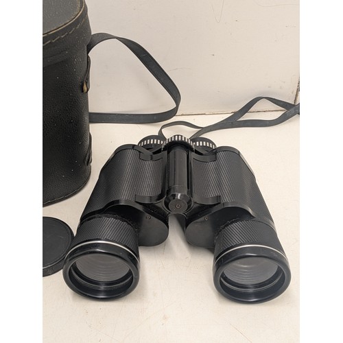 1038 - A Pathescope coated optics 16x50 binoculars in leather case