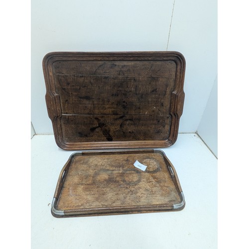 1053 - A pair of vintage oak service trays