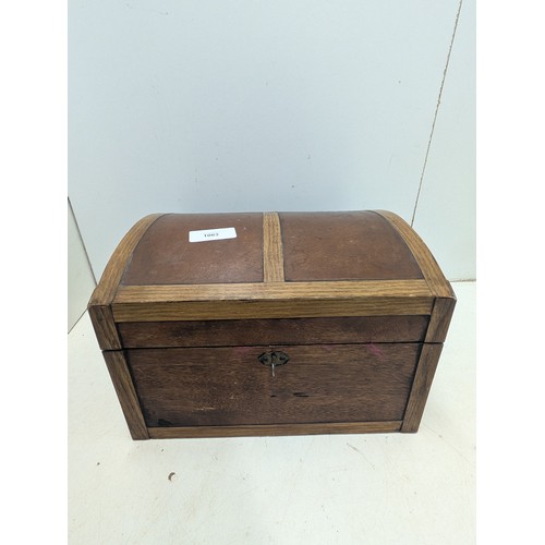 1063 - An antique styled Oak Jewellery box with brass features