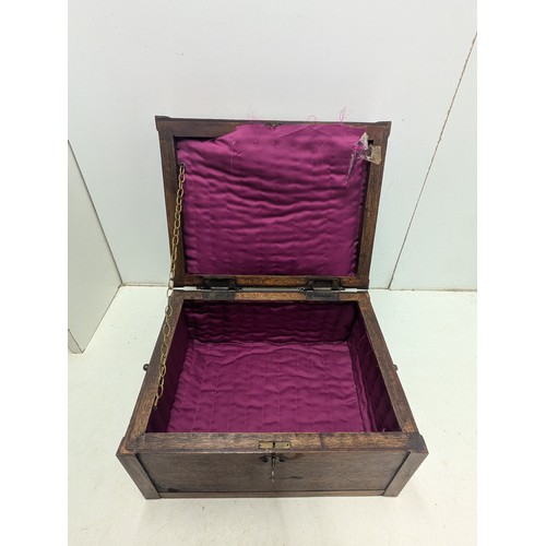 1063 - An antique styled Oak Jewellery box with brass features