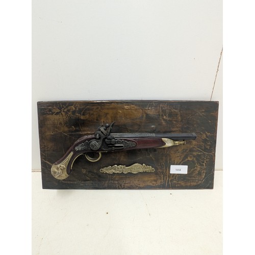 1058 - A Replica Flintlock Pistol mounted to a Copper wrapped backing