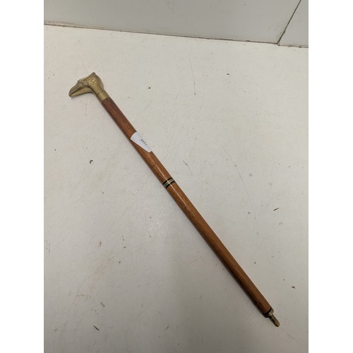 1059 - A partially incomplete walking stick with a brass eagle head