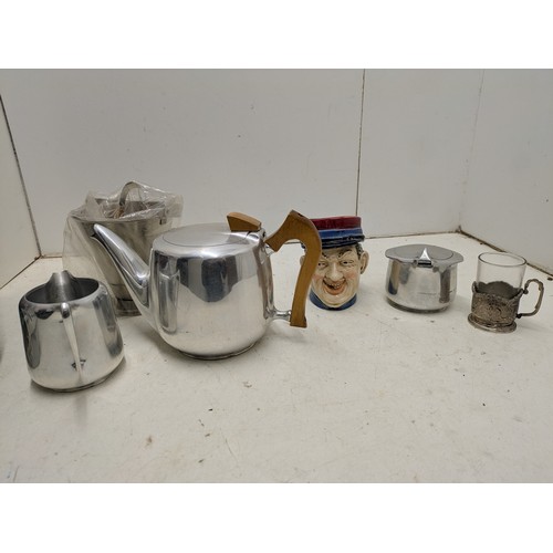 1012 - A Large quantity of various retro kitchen ware including piquot ware