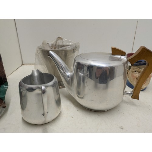 1012 - A Large quantity of various retro kitchen ware including piquot ware