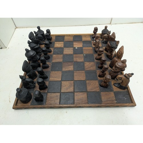 2010 - An African themed chess set with board and pieces - 2 pieces missing