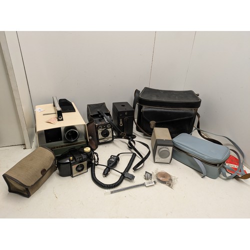 1046 - A Large Selection of vintage camera equipment in cases