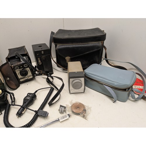 1046 - A Large Selection of vintage camera equipment in cases