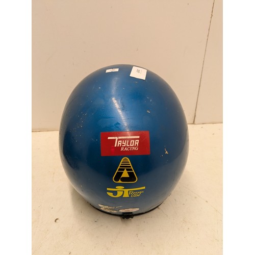 2057 - A Vintage Taylor & Sons Motorcycle helmet in a metallic blue colour, with various decals including H... 