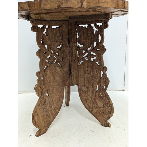 607 - A Carved oak inlaid table with floral patternation