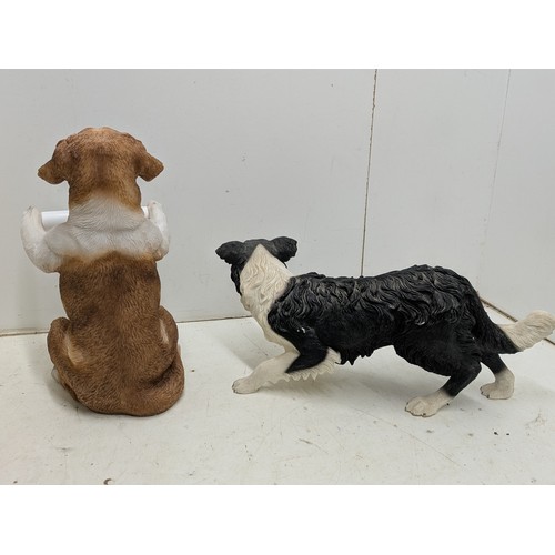 2047 - A pair of dog ornaments including a toilet roll holder