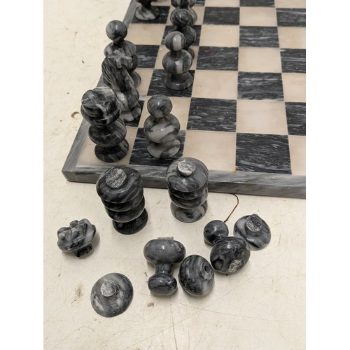 1062 - A Charming Marble Chess set with Marble board - one piece missing, some pieces damaged