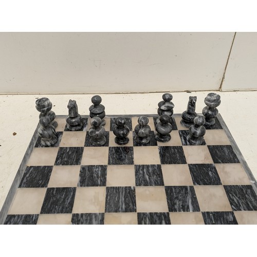 1062 - A Charming Marble Chess set with Marble board - one piece missing, some pieces damaged