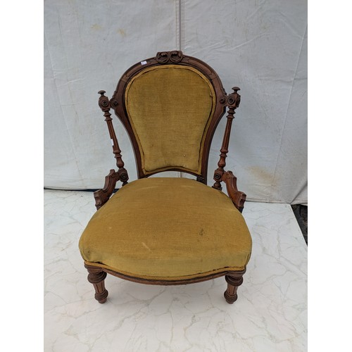 609 - A Small Oak chair with upholstered back and base - early 20th century