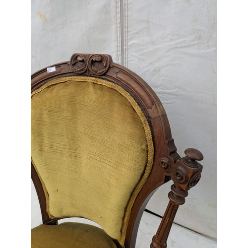 609 - A Small Oak chair with upholstered back and base - early 20th century