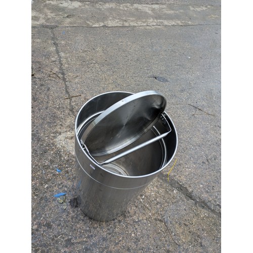 612 - A Large Stainless Steel revolving lid recycling bin