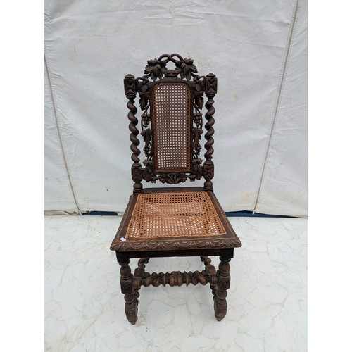 608 - A Large Stained Oak traditional English carved chair with barley twist legs and wicker back