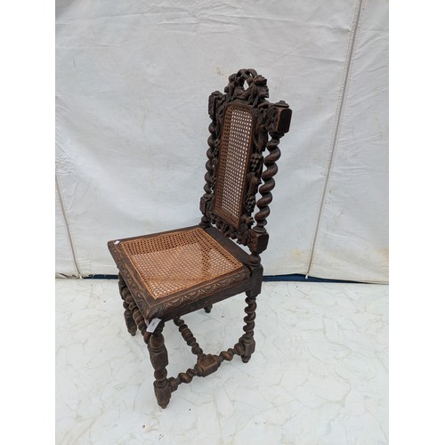 608 - A Large Stained Oak traditional English carved chair with barley twist legs and wicker back