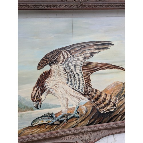 1048 - An oil on canvases painting of a hawk eating a fish by Winton, with a quality vintage wood carved fr... 