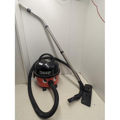 1404 - A Henry Pneumatic Vacuum Cleaner with hose and Attachment