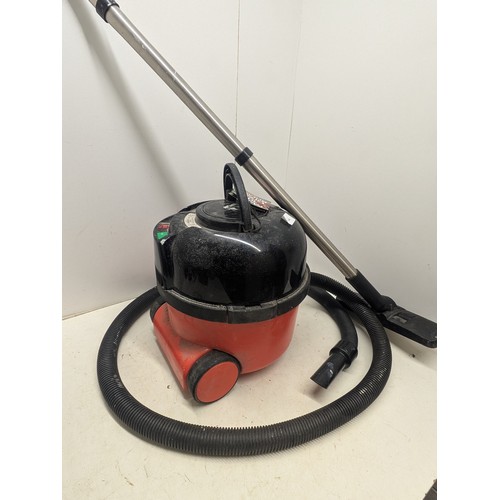 1404 - A Henry Pneumatic Vacuum Cleaner with hose and Attachment