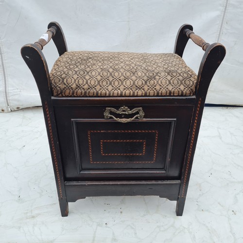 629 - An Antique Stained Oak Seat With Detailed Wooden Inlay and Brass Accents