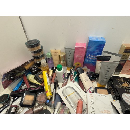 2056 - A large quantity of women's makeup including Avon, sleek, revolution pro, etc