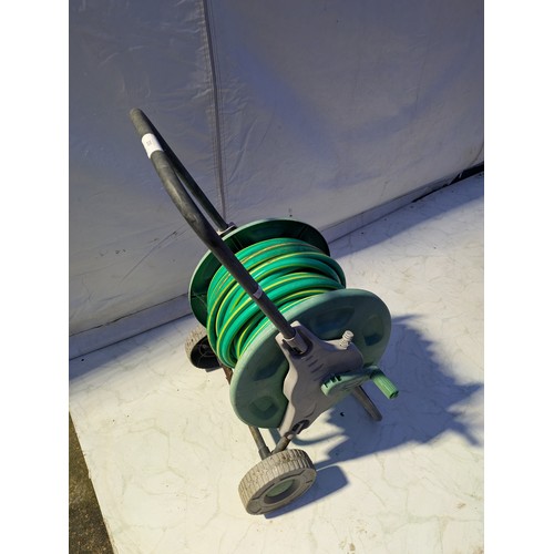 230 - A 30 Meter Garden Hose with Wheels