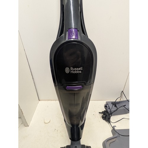 1489 - A Russell Hobbs Turbo Vac Pro Vacuum with heads and charger - Powers on