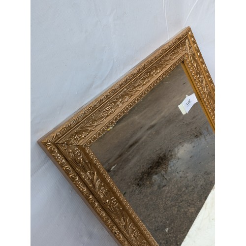 2073 - A Large Rectangular wooden guilded mirror - frame depicting berries and leaves